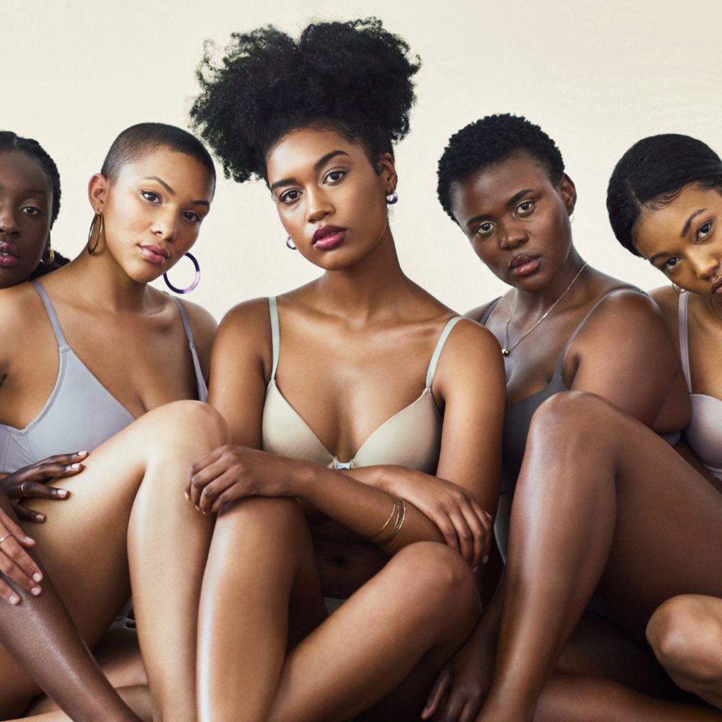 five beautiful black women in underwear and bra sitting on floor.jpg